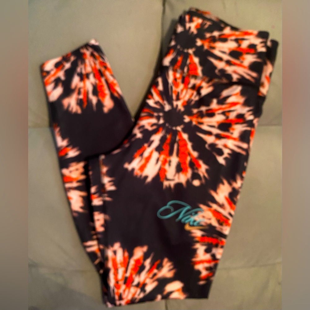Small black and orange Nike leggings